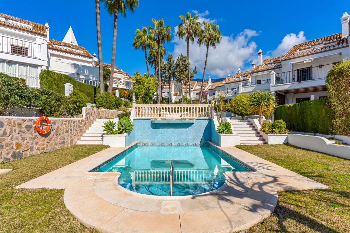 South-facing four-bedroom townhouse located in the gated community of Montepiedra , Nagueles within the Golden Mile, Marbella