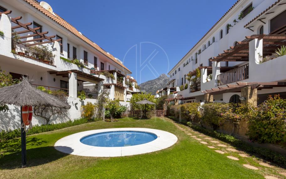 Lovely ground floor, West facing, three-bedroom apartment in the gated and well-established community Coto Real
