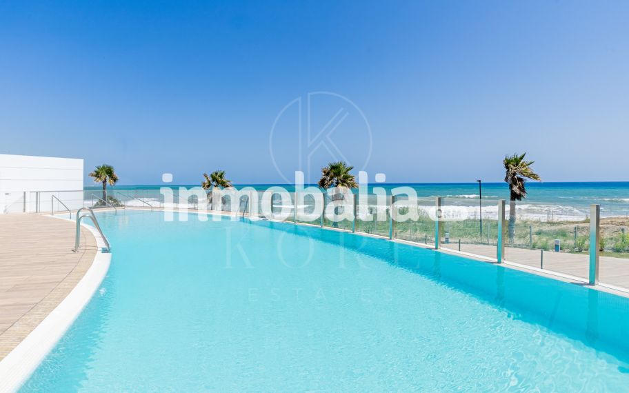 Luxurious beachfront apartment with private garden