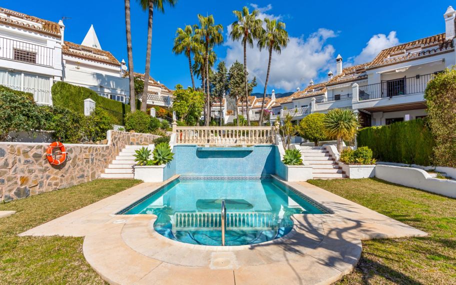 South-facing four-bedroom townhouse located in the gated community of Montepiedra , Nagueles within the Golden Mile, Marbella